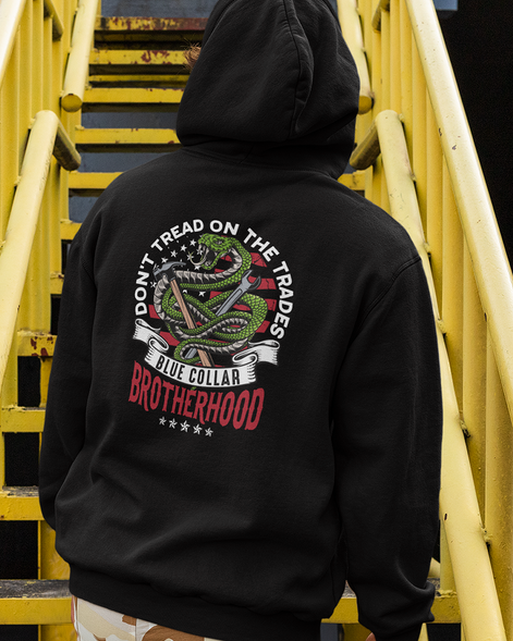 Don't Tread on Trades Proud Hooded Sweatshirt in black, gray or blue, featuring bold yellow and white lettering with a tough 'Don’t Tread on Me' inspired design. Ideal for skilled tradesmen, including electricians, welders, and carpenters. Heavyweight, durable material for year-round comfort and protection on the job site. Show pride in the trades with this iconic hoodie.