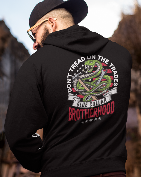 Don't Tread on Trades Proud Hooded Sweatshirt in black, gray or blue, featuring bold yellow and white lettering with a tough 'Don’t Tread on Me' inspired design. Ideal for skilled tradesmen, including electricians, welders, and carpenters. Heavyweight, durable material for year-round comfort and protection on the job site. Show pride in the trades with this iconic hoodie.