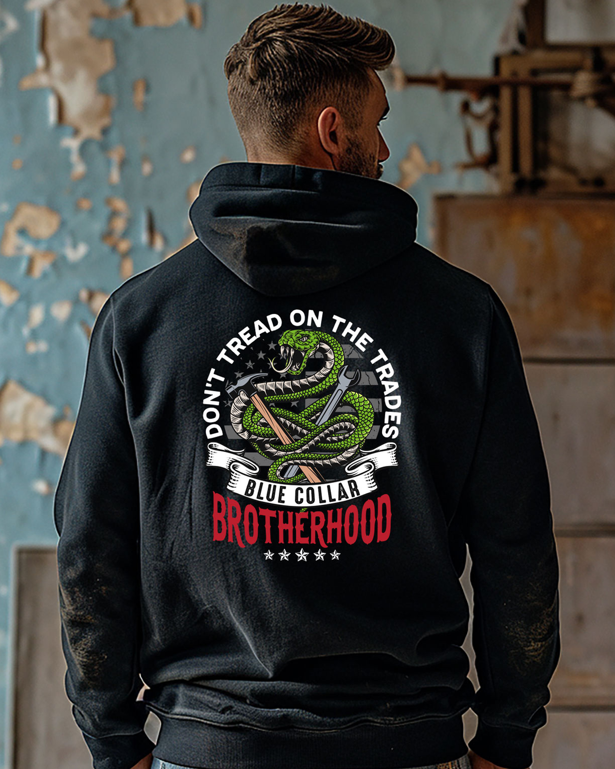 Don't Tread on Trades Proud Hooded Sweatshirt in black, gray or blue, featuring bold yellow and white lettering with a tough 'Don’t Tread on Me' inspired design. Ideal for skilled tradesmen, including electricians, welders, and carpenters. Heavyweight, durable material for year-round comfort and protection on the job site. Show pride in the trades with this iconic hoodie.