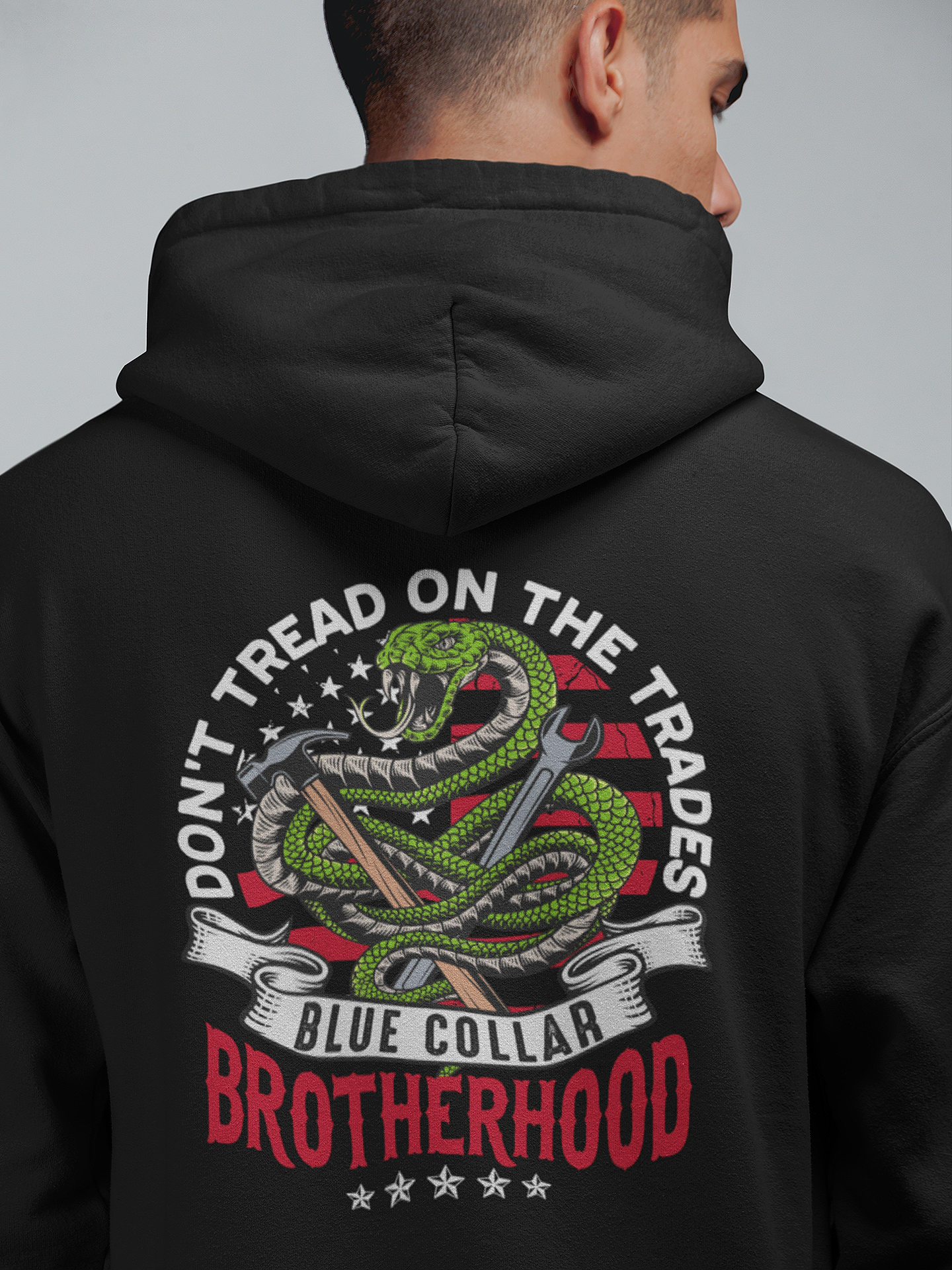 Don't Tread on Trades Proud Hooded Sweatshirt in black, gray or blue, featuring bold yellow and white lettering with a tough 'Don’t Tread on Me' inspired design. Ideal for skilled tradesmen, including electricians, welders, and carpenters. Heavyweight, durable material for year-round comfort and protection on the job site. Show pride in the trades with this iconic hoodie.